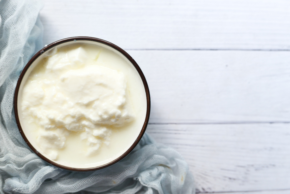 Close up of Fresh Yogurt in a Bowl on Wooden Background